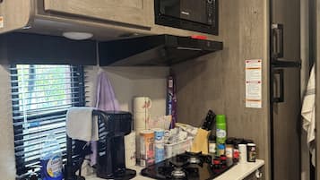 Fridge, microwave, stovetop, coffee/tea maker