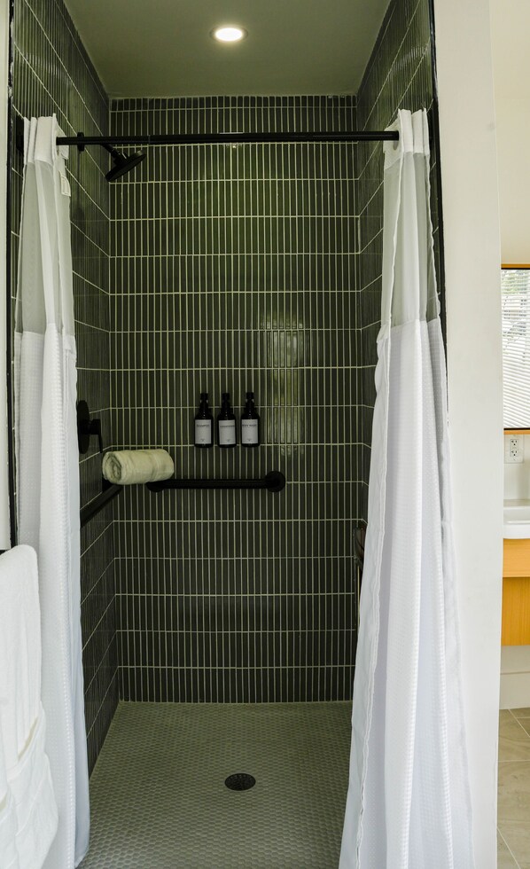 Family Apartment | Bathroom | Shower, hair dryer, slippers, towels - The Jaxon (West Palm Beach)