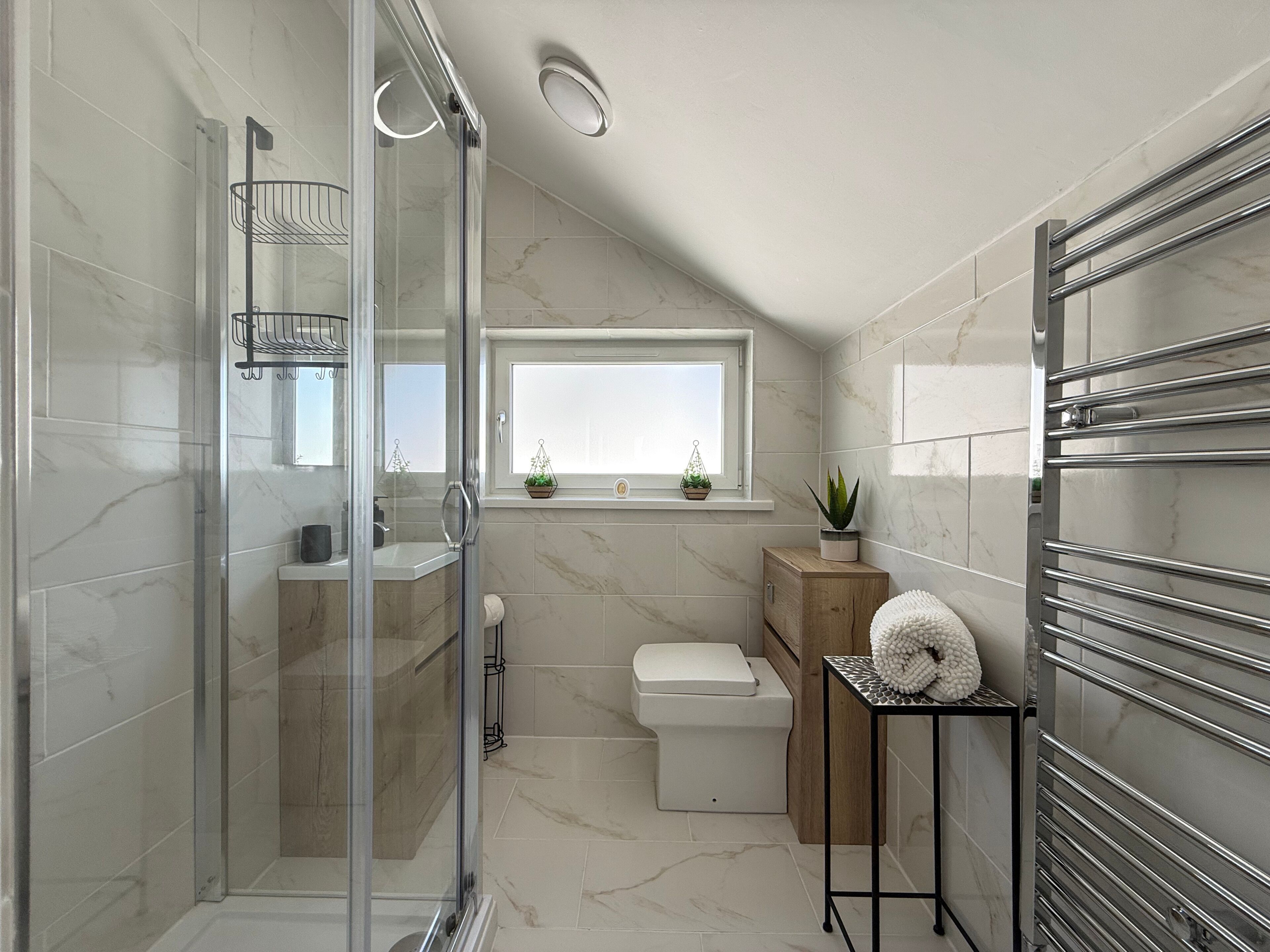 Shower, hair dryer, towels, toilet paper
