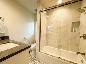 Shower, hair dryer, towels, soap