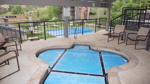 A hot tub area with a view of a residential neighborhood. - Magnificent, newly remodeled Snowmass Condo (Snowmass Village)