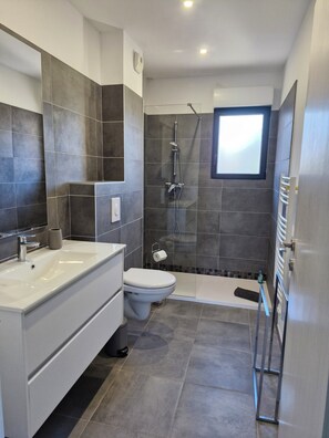 Shower, hair dryer, towels, soap