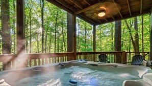 A hot tub on a wooden deck with a forest view. - FreeDollywood Tix/Secluded/Pool Table/Spacious (Gatlinburg)