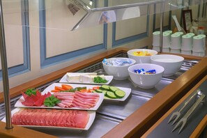 A buffet with various food items including sliced meats, cheeses, and fresh vegetables. - Landgasthof-Hotel Rebstock  (Stuehlingen)
