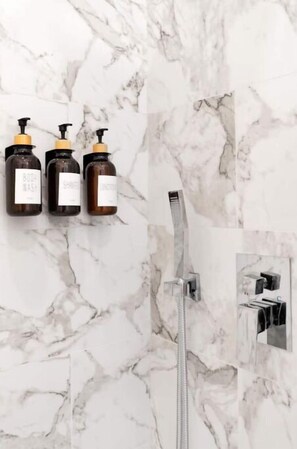 Shower, hair dryer, towels, soap