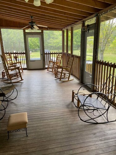 Spacious 4-bedroom farmhouse with 20 acres surrounded by a whitewater creek.