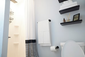 Shower, towels, soap, toilet paper