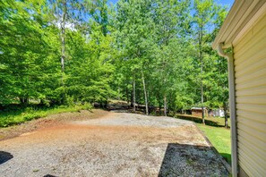Surrounded by lush greenery, this tranquil outdoor space offers a serene escape.