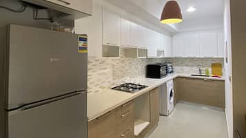 Fridge, oven, electric kettle, cookware/dishes/utensils