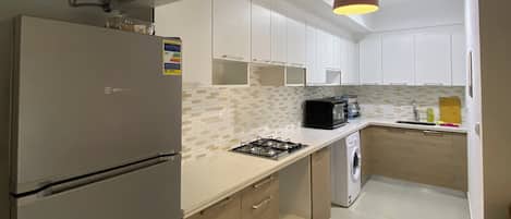 Fridge, oven, electric kettle, cookware/dishes/utensils