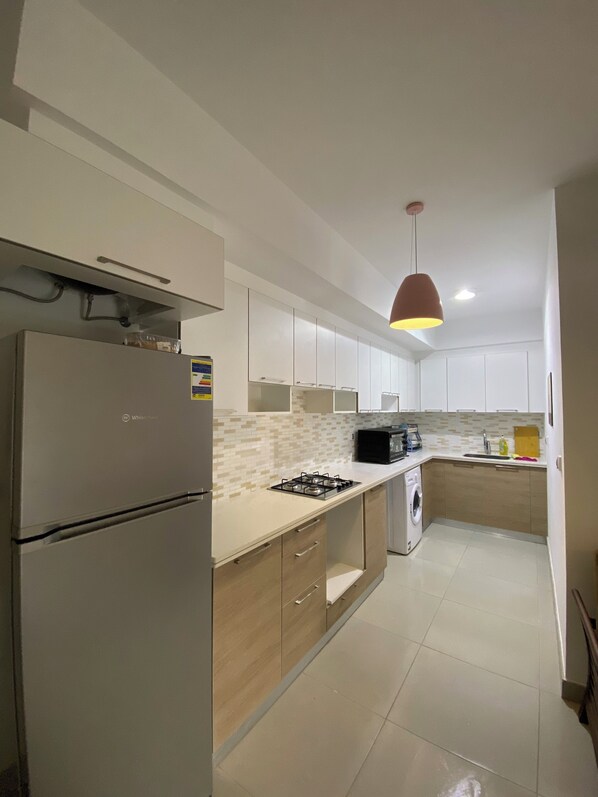 Fridge, oven, electric kettle, cookware/dishes/utensils