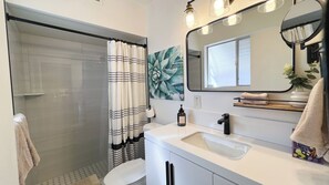 Shower, hair dryer, towels, soap