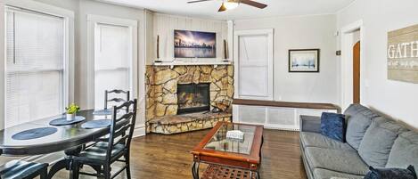 Smart TV, fireplace, books, printers