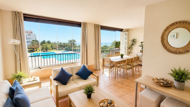 A modern hotel room with a balcony, a pool view, a dining area, and a living space. - Los Pelícanos - Ref.412 (Punta del Moral)