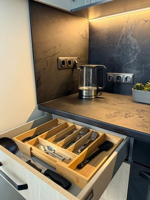 Enjoy cooking in this well-equipped kitchen with a coffee maker and ample storage.