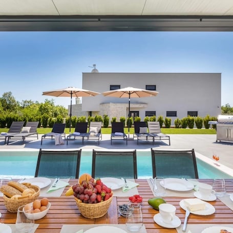 Outdoor dining. Spacious 5-bedroom villa in gorgeous Brekovica with AC, WiFi