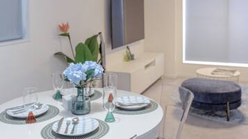 Superior Villa, Balcony | Living area | 50-inch flat-screen TV with cable channels