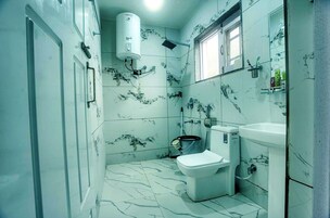 Standard Double Room | Bathroom | Shower, free toiletries, slippers, towels