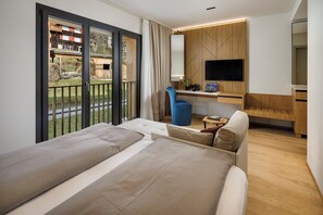 Deluxe Double Room, Hill View | In-room safe, desk, laptop workspace, blackout curtains - Panoramahotel Braunwald (Glarus Sued)