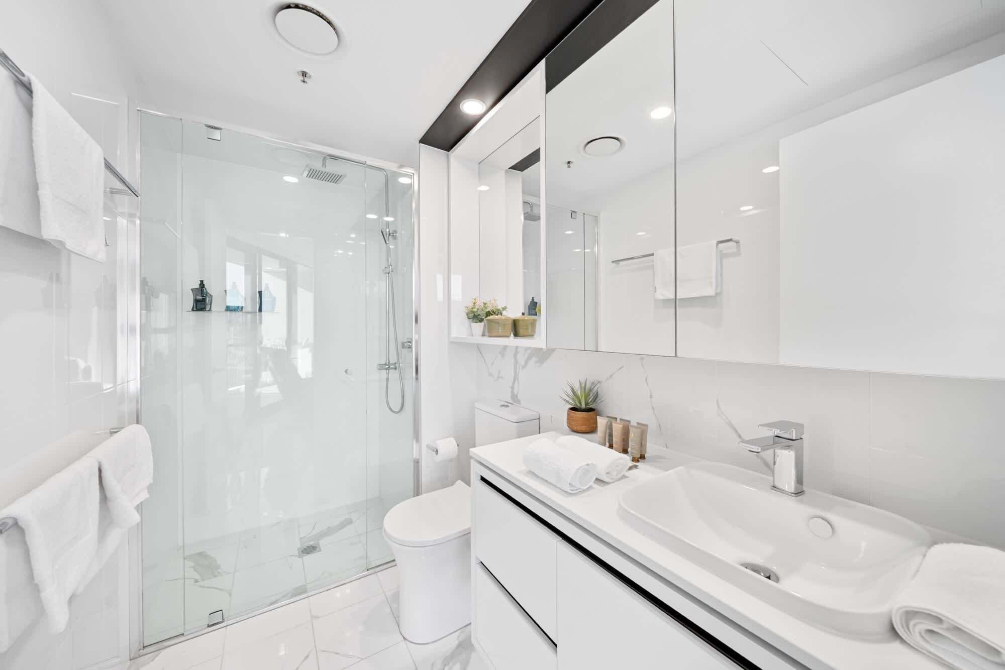 Shower, hair dryer, towels, shampoo