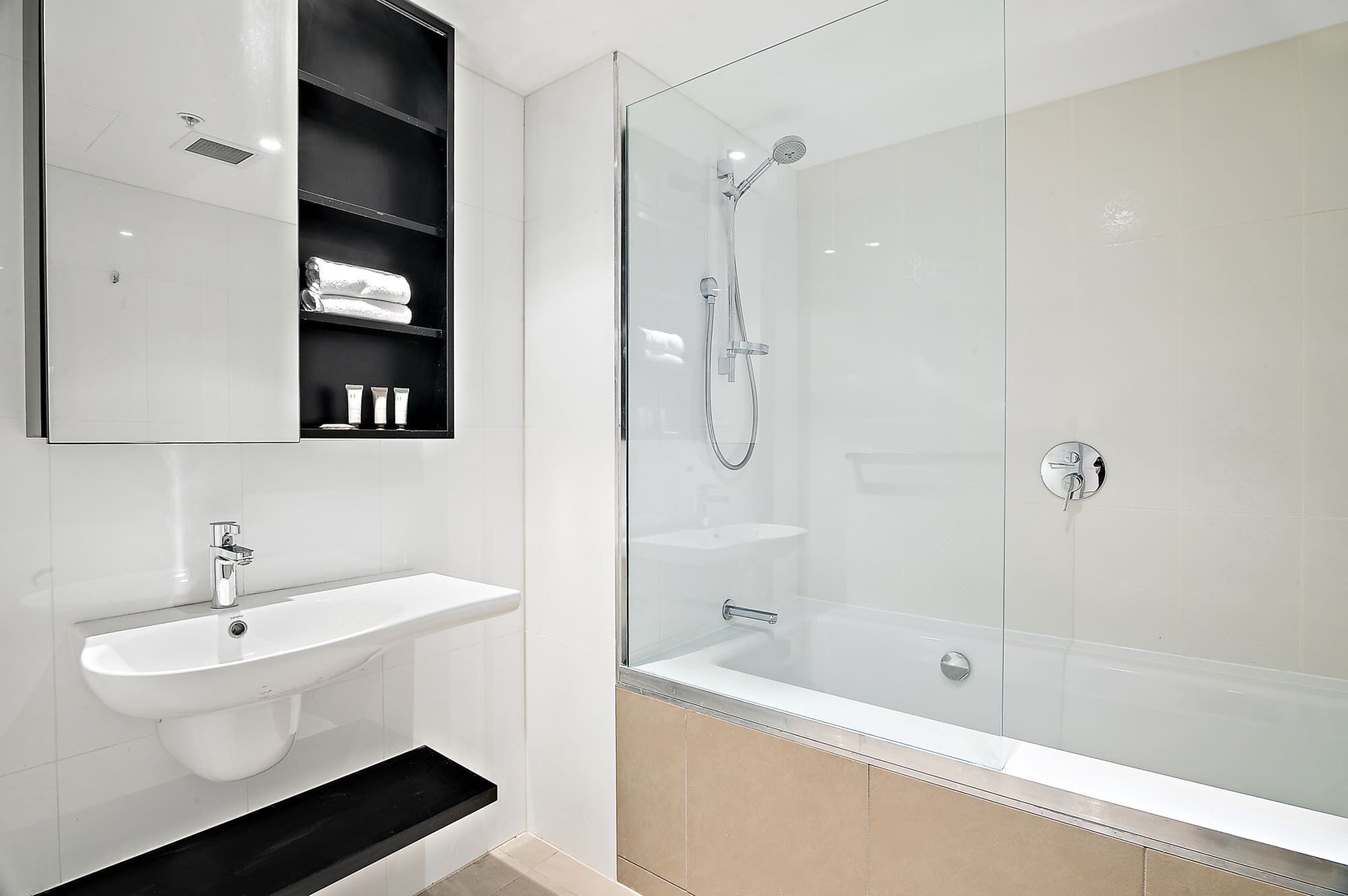 Shower, hair dryer, towels, shampoo