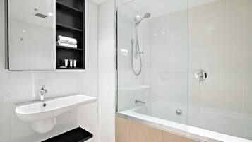 Shower, hair dryer, towels, shampoo