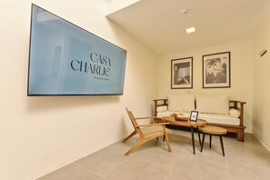 Family Loft | Living area | 43-inch LED TV with digital channels, Netflix, streaming services - Casa Charlie Hotel (Makati)