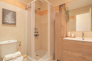 Shower, hair dryer, towels, soap