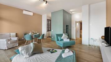 Family Apartment, 1 Bedroom, Terrace, Mountainside (Lake View Escape Apartment with Pool,) | Living area | Flat-screen TV
