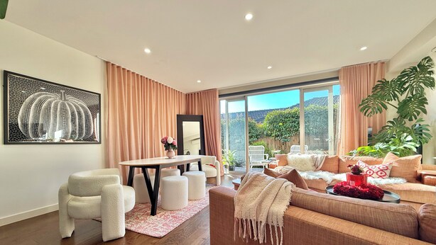 A modern living room with a dining area, large windows, and a view of the outdoors. - Soft Modern Glamour in the Heart of Camberwell (Camberwell)