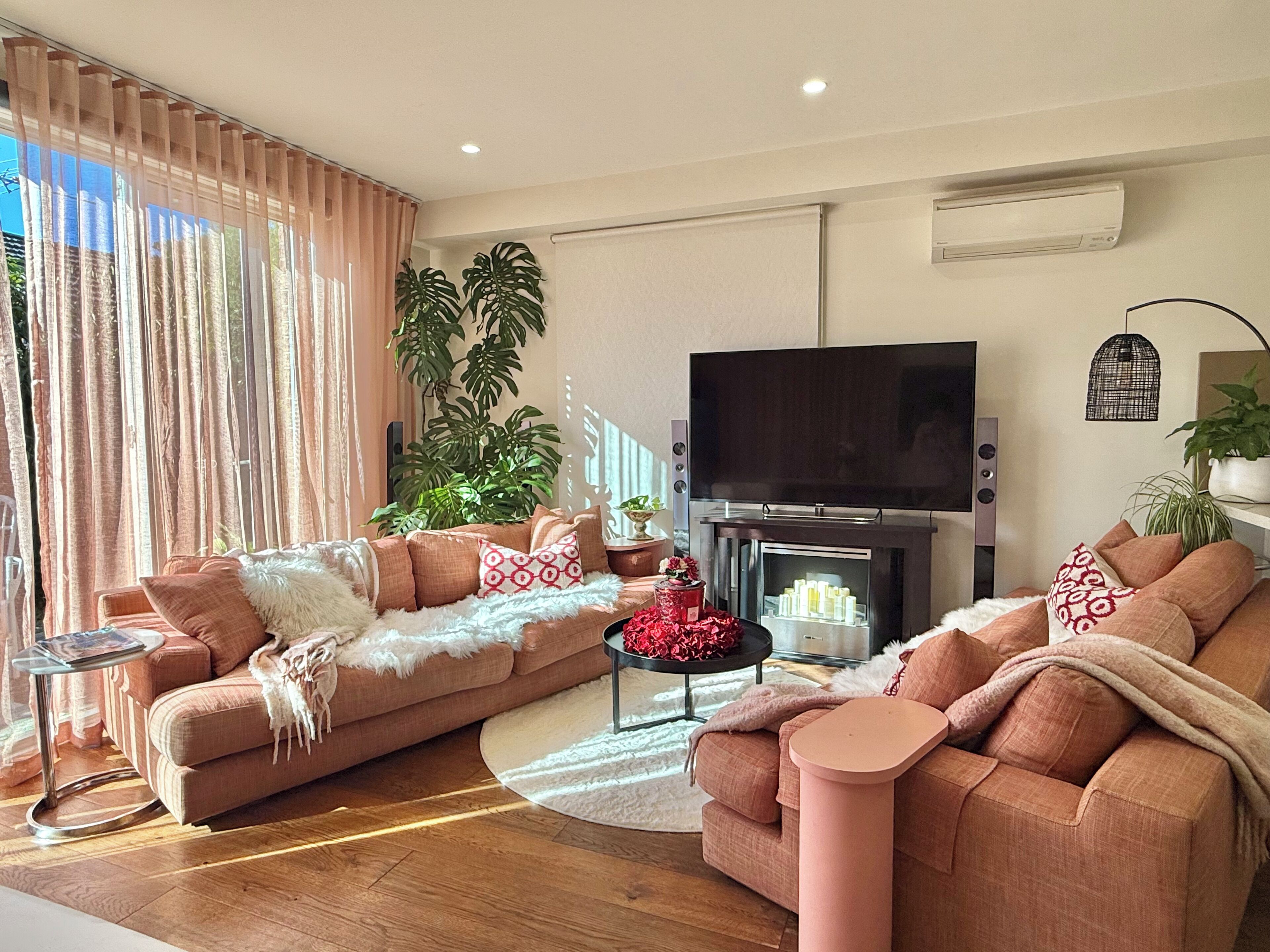 Smart TV, fireplace, books, printers