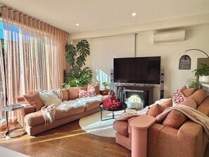 Smart TV, fireplace, books, printers