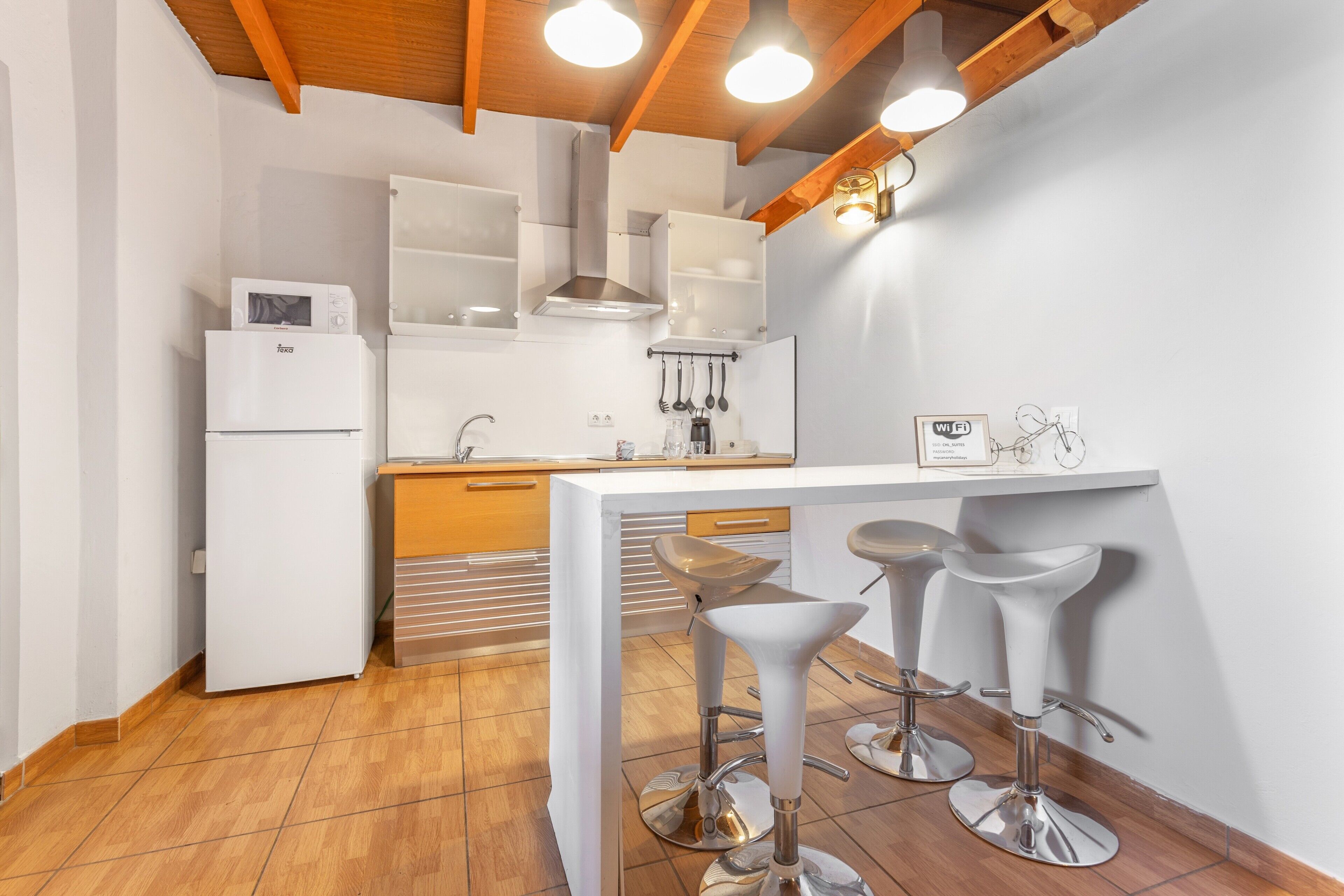 Fridge, microwave, stovetop, coffee/tea maker