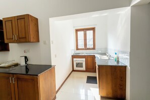 Fridge, stovetop, electric kettle, toaster