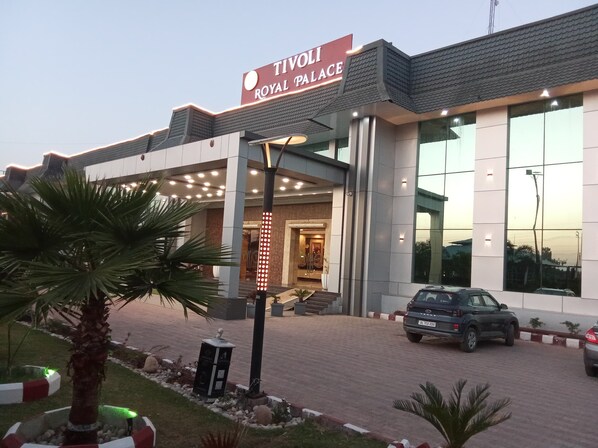 A modern building with a sign reading "Tivoli Royal Palace". - Tivoli Royal Palace (Palwal)