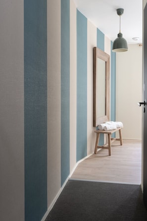 Suite Deluxe, baño privado | 1 dormitorio, ropa de cama de alta calidad, caja fuerte