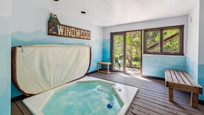 A room with a wooden deck, a hot tub, and a view of the outdoors. - HotTub, Grill | Main St-Shops, Lake (Frisco)