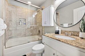 Shower, hair dryer, towels, shampoo