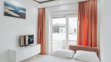 Comfort Apartment, Balcony | Living area | Flat-screen TV