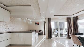 Penthouse, Balcony, City View | Living area | Flat-screen TV