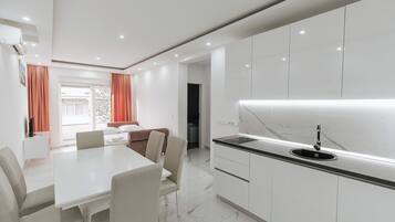 Comfort Apartment, Balcony | Living area | Flat-screen TV