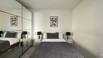 1 bedroom, desk, iron/ironing board, travel crib