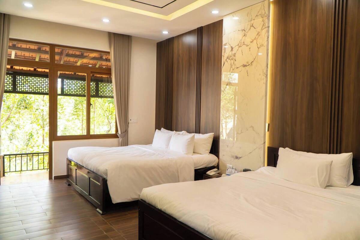 Family Quadruple Room | Minibar, desk, laptop workspace, iron/ironing board