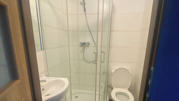 Basic Double Room | Bathroom | Shower, towels, soap, toilet paper