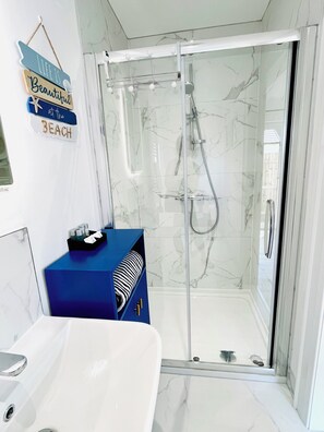 Shower, hair dryer, towels, soap
