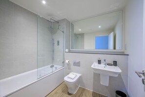 Shower, hair dryer, towels, shampoo