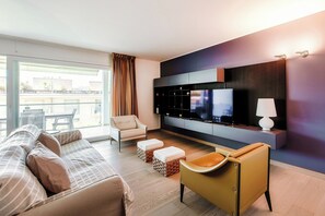 Luxury Apartment, City View | Living area | 32-inch flat-screen TV with digital channels