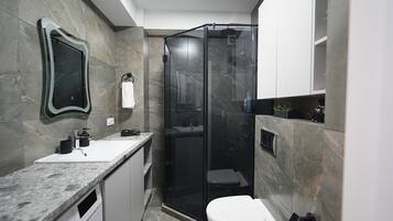 Shower, hair dryer, towels, soap