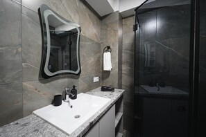 Shower, hair dryer, towels, soap