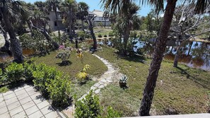 Stroll through a serene garden oasis, surrounded by lush greenery and tranquil water features.